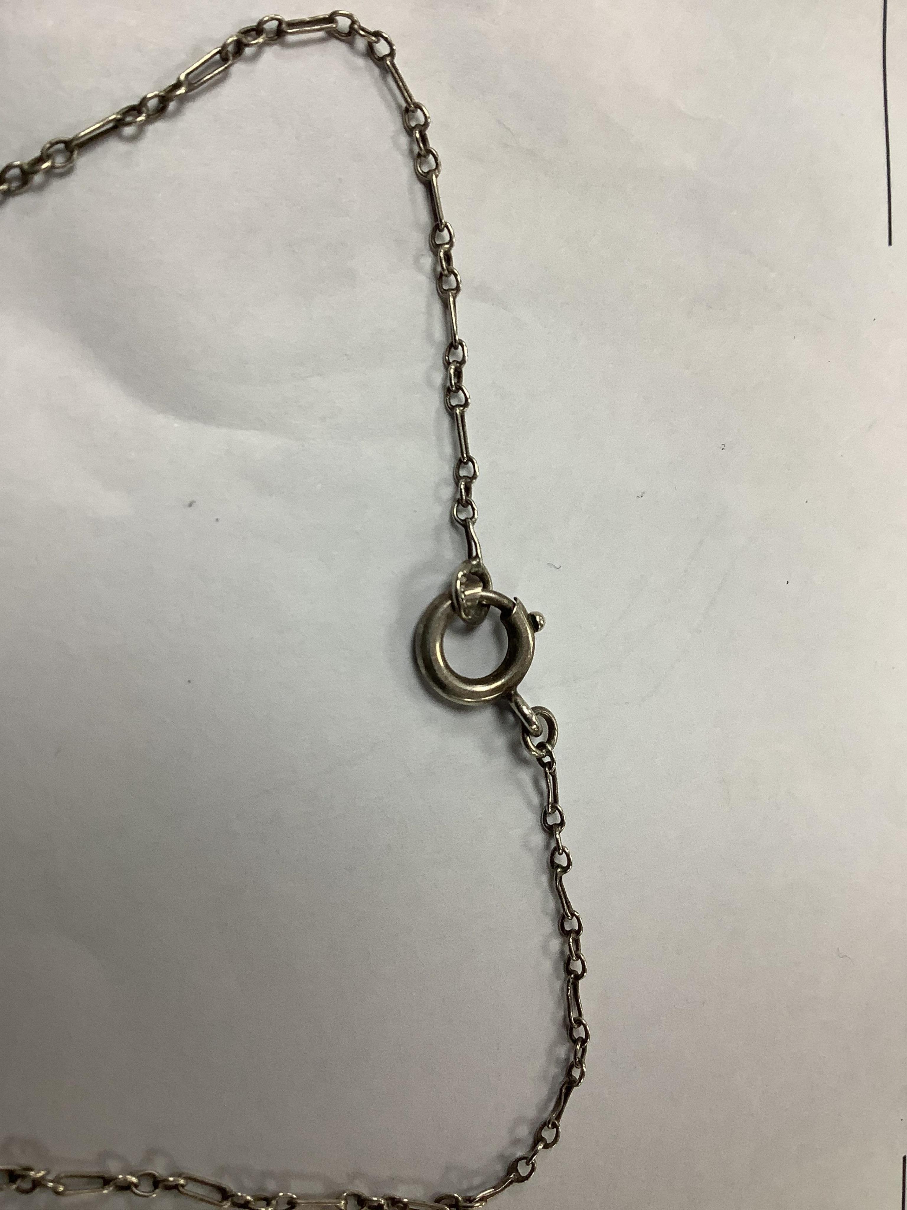 A white metal and green paste set double drop pendant necklace, 54cm and a similar brooch. Condition - fair to good